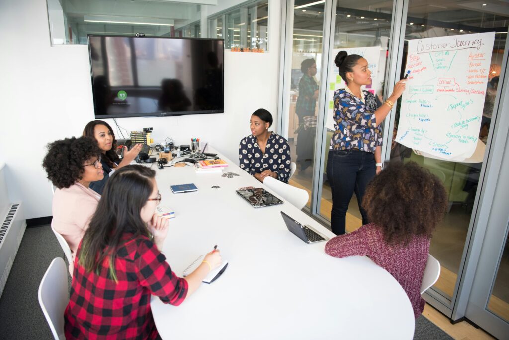 professional development workshops for school improvementengages in a collaborative brainstorming session around a conference table.